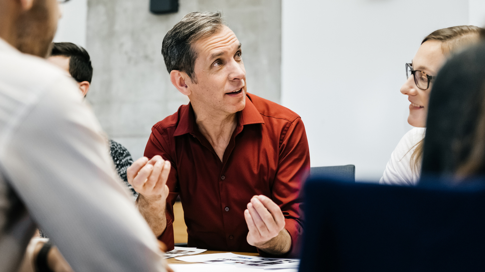 Southern Cross - Mindfulness lead and inspire A man talks during a discuss at work