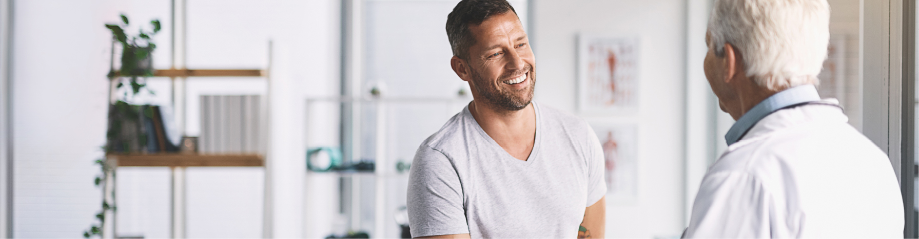 Southern Cross - A man smiles while talking to a doctor A man smiles while talking to a doctor